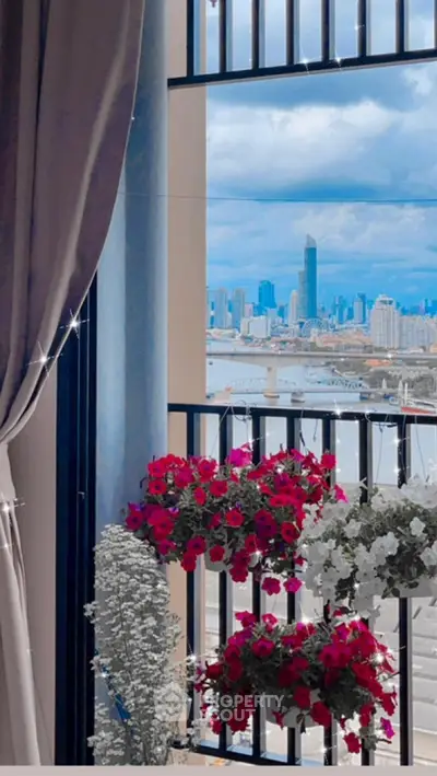 Stunning balcony view with vibrant flowers overlooking city skyline and river