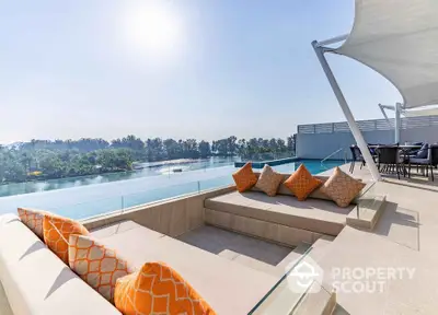 Luxurious rooftop terrace with infinity pool and stunning water view