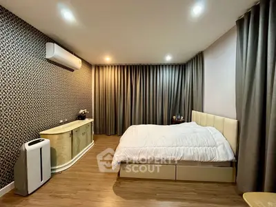 Modern bedroom with stylish wallpaper and cozy lighting