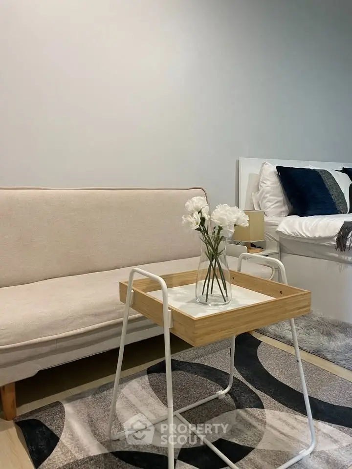 Chic modern living room with cozy sofa and stylish decor, perfect for relaxation and comfort.