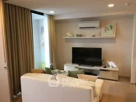 Modern living room with stylish decor and air conditioning