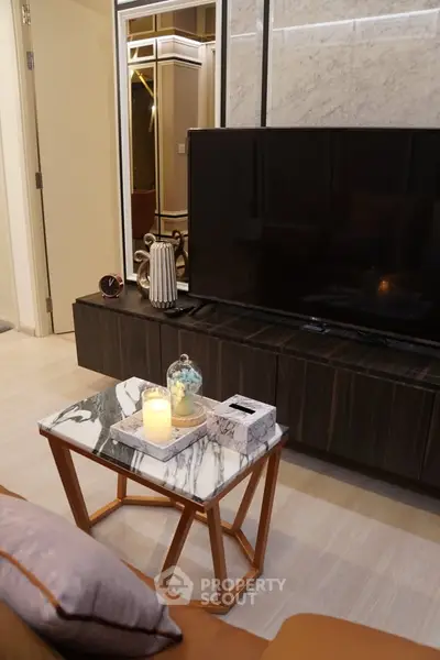 Stylish modern living room with marble coffee table and large TV