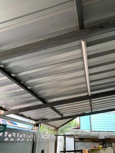 Modern metal roof structure in residential property showcasing durability and design.