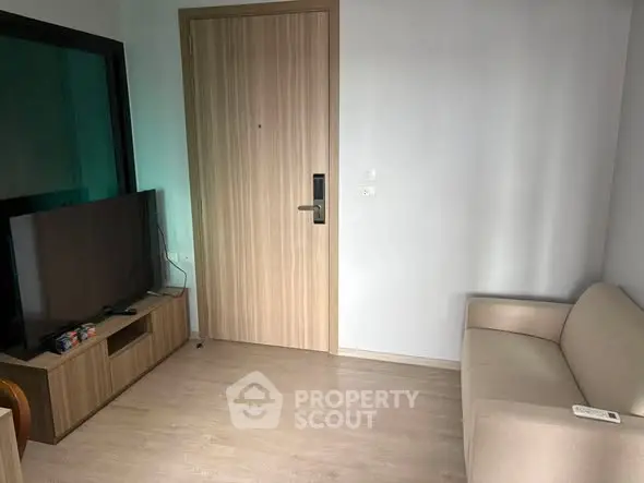 Cozy living room with modern TV setup and comfortable sofa