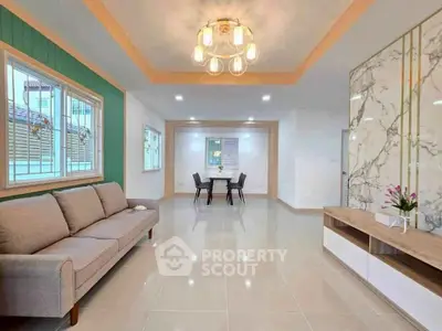 Spacious modern living room with elegant lighting and stylish decor