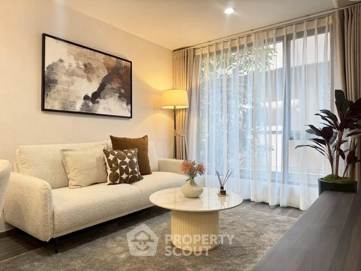 Elegant living room with modern decor and natural light