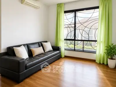 Modern living room with stylish black sofa, large window, and green curtains.