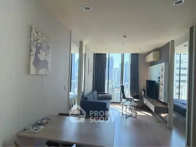 Modern living room with city view, stylish decor, and natural light