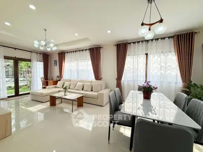 Spacious living and dining area with modern decor and ample natural light.