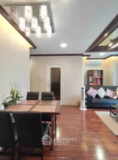 Modern living room with elegant dining area and stylish lighting