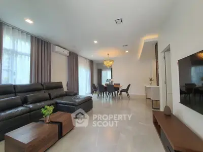 Spacious modern living room with elegant dining area and luxurious decor