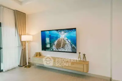 Modern living room with stylish TV setup and elegant decor