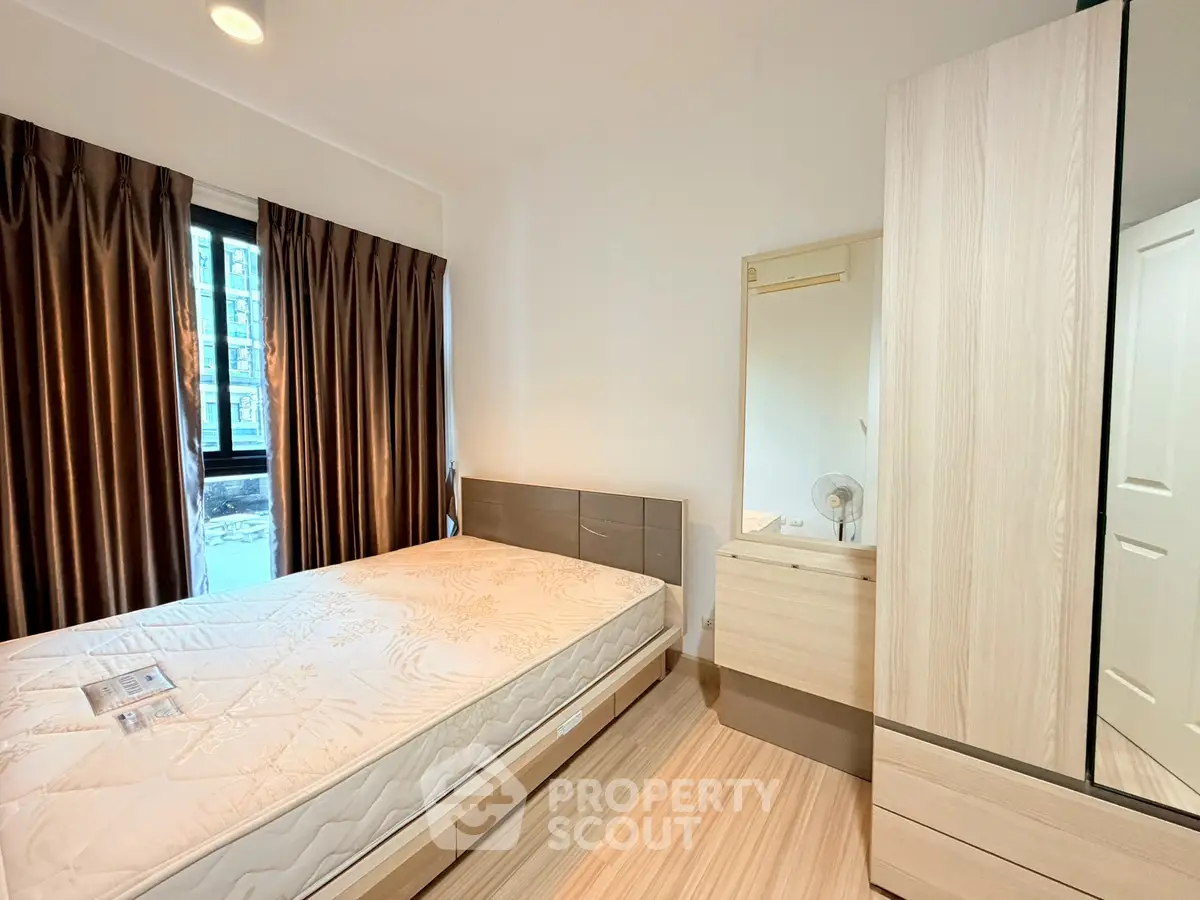 Modern bedroom with stylish decor and ample natural light