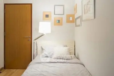 Cozy small bedroom with modern decor and soft lighting