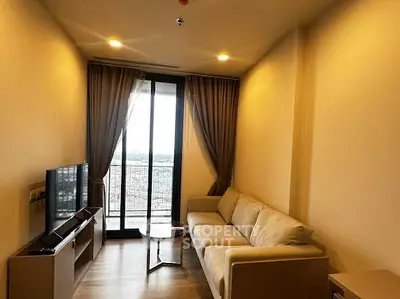 Modern living room with cozy sofa and large window offering stunning city view.