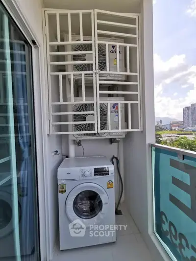Modern balcony with washing machine and air conditioning units in urban apartment