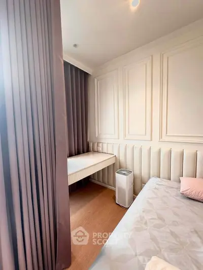 Cozy bedroom with elegant paneling and soft lighting, perfect for relaxation.