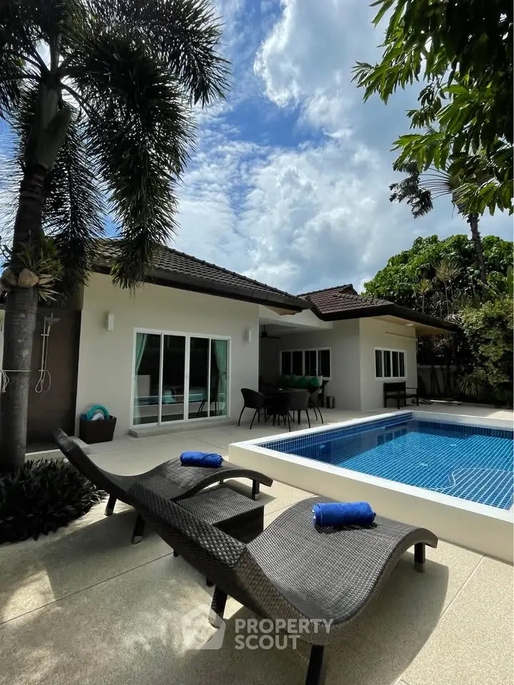 Luxurious villa with private pool and lush garden, perfect for tropical living.