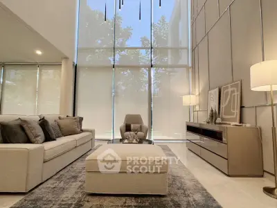 Luxurious modern living room with high ceilings and elegant decor