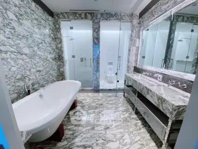 Luxurious marble bathroom with freestanding bathtub and dual sinks