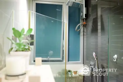 Modern bathroom with glass shower and sleek fixtures