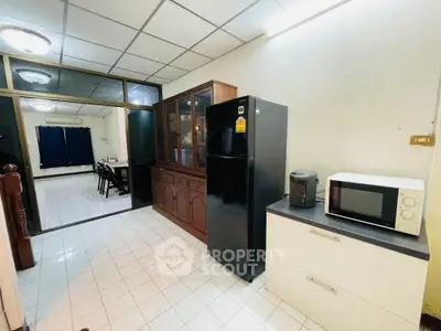 Spacious kitchen with modern appliances and dining area in open layout