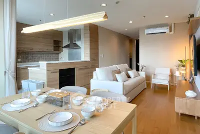 Modern open-plan living room with elegant dining area and stylish kitchen