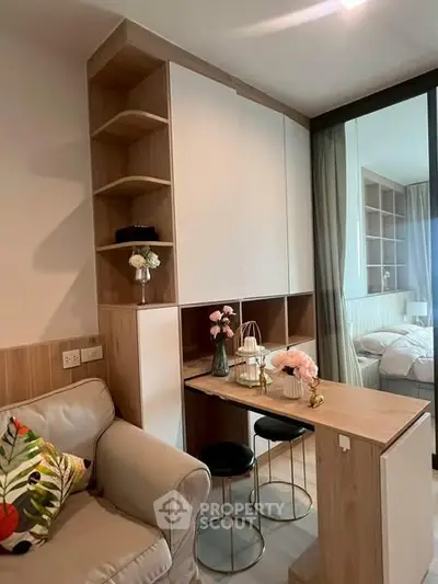 Modern studio apartment with stylish decor and cozy seating area