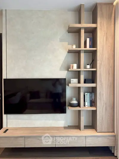 Modern living room with sleek TV unit and stylish shelving