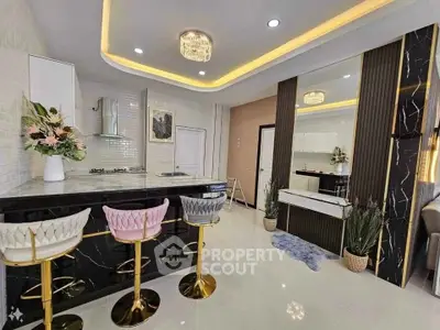 Luxurious modern kitchen with elegant bar stools and stylish lighting