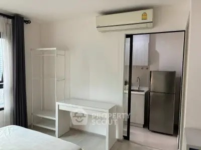 Modern apartment interior with air conditioning and sleek kitchen area