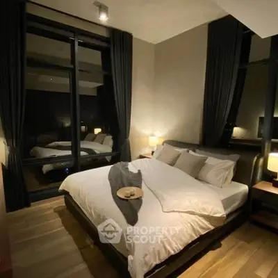 Luxurious modern bedroom with large windows and elegant decor