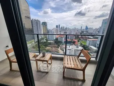 Stunning cityscape view from a modern high-rise balcony with stylish wooden chairs.