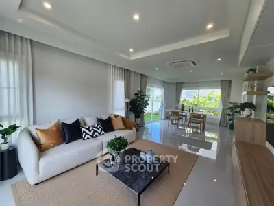 Spacious modern living room with elegant decor and abundant natural light
