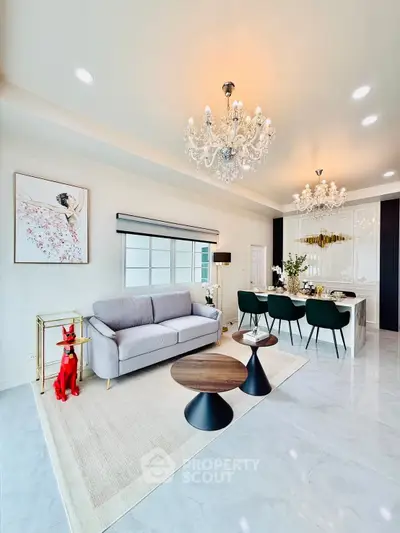 Luxurious living room with elegant chandelier and modern decor