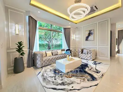 Luxurious living room with elegant decor and large window view