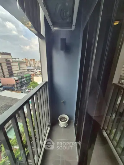 Compact balcony with city view, ideal for urban living