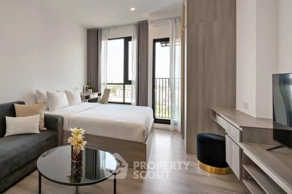 Modern studio apartment with stylish decor and city view