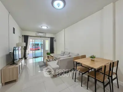 Spacious modern living room with sleek furniture and natural light