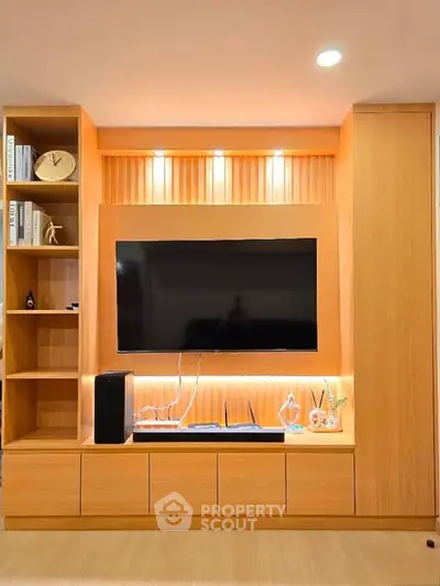 Modern living room with built-in wooden TV unit and ambient lighting