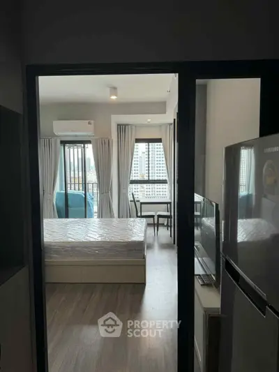 Modern apartment interior with bedroom and city view balcony