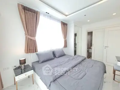 Modern bedroom with elegant decor and natural light