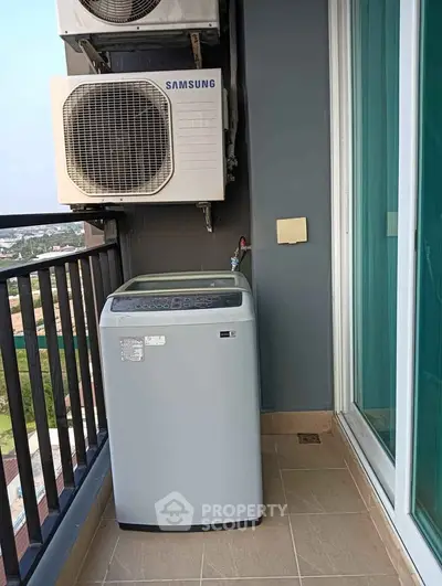 Modern balcony with washing machine and air conditioning unit, offering practical outdoor utility space.
