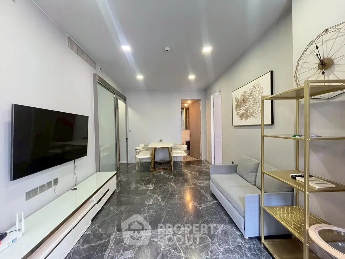 Modern living room with sleek marble flooring and stylish decor