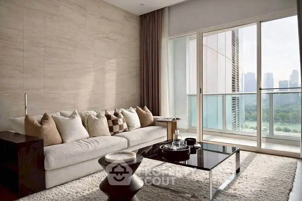 Luxurious living room with modern decor and stunning city view from large windows.