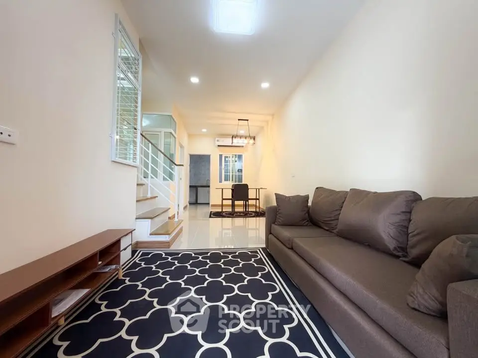 Modern living room with stylish decor and comfortable seating in a contemporary home.