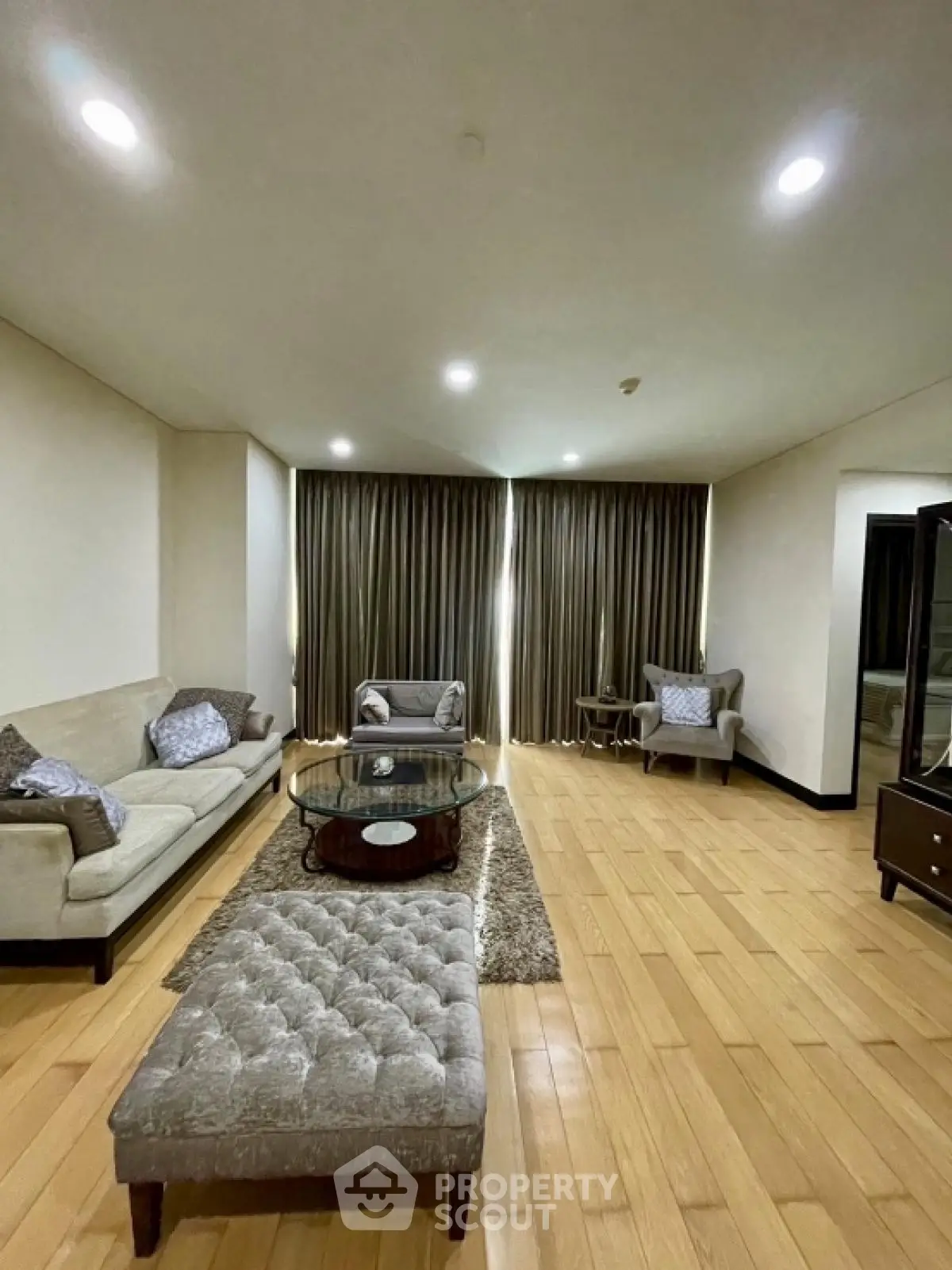 Spacious living room with elegant furniture and wooden flooring