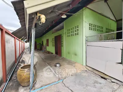 Explore this unique property with rustic charm and spacious outdoor area, perfect for creative renovations.