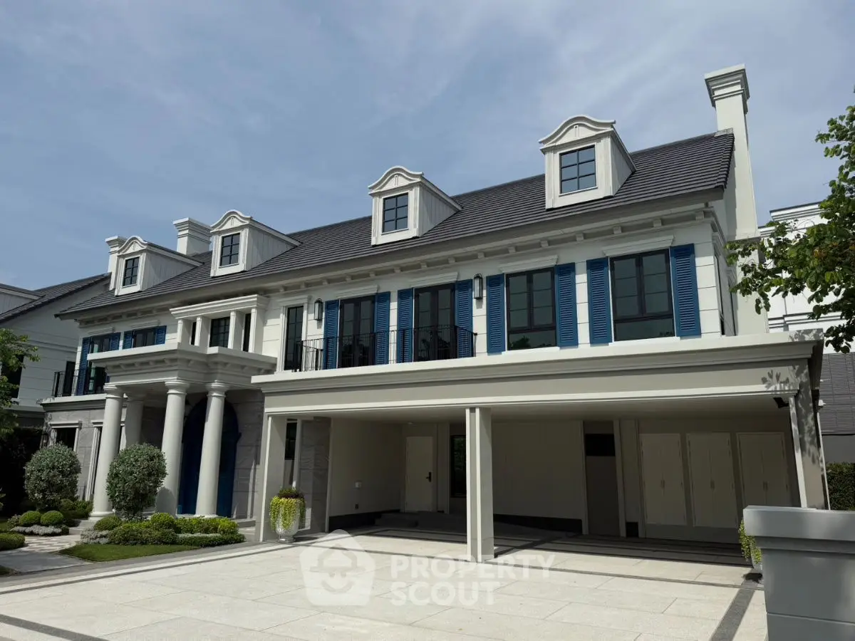 Luxurious modern mansion with elegant architecture and spacious driveway, perfect for upscale living.