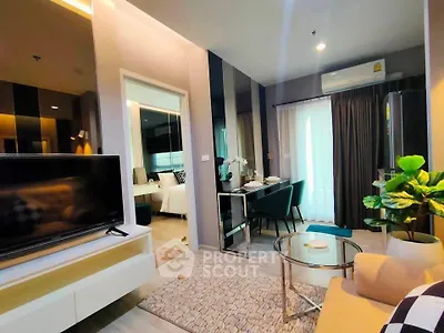Modern living room with stylish decor and open layout, featuring a cozy dining area and natural light.